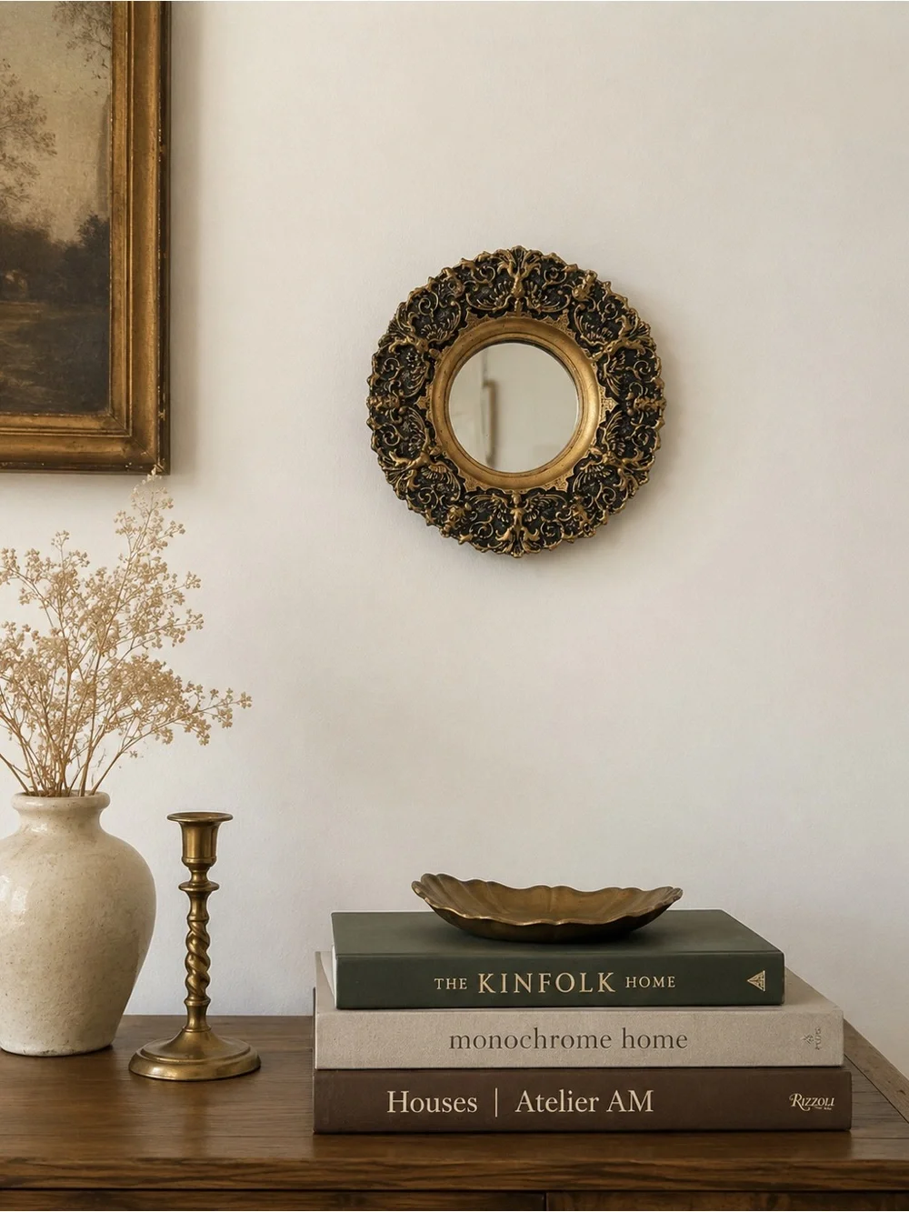 ornate baroque-style miniature round wall mirror featuring an antiqued gold and